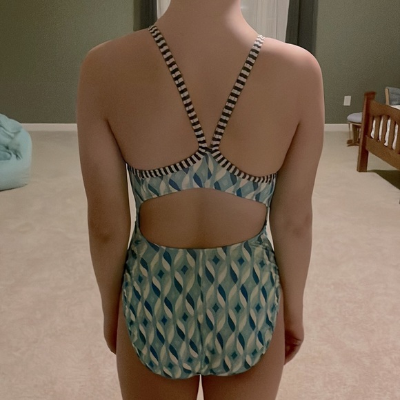 this is a very loved dolphin uglies one piece swim suit in the size 32. - Picture 2 of 3